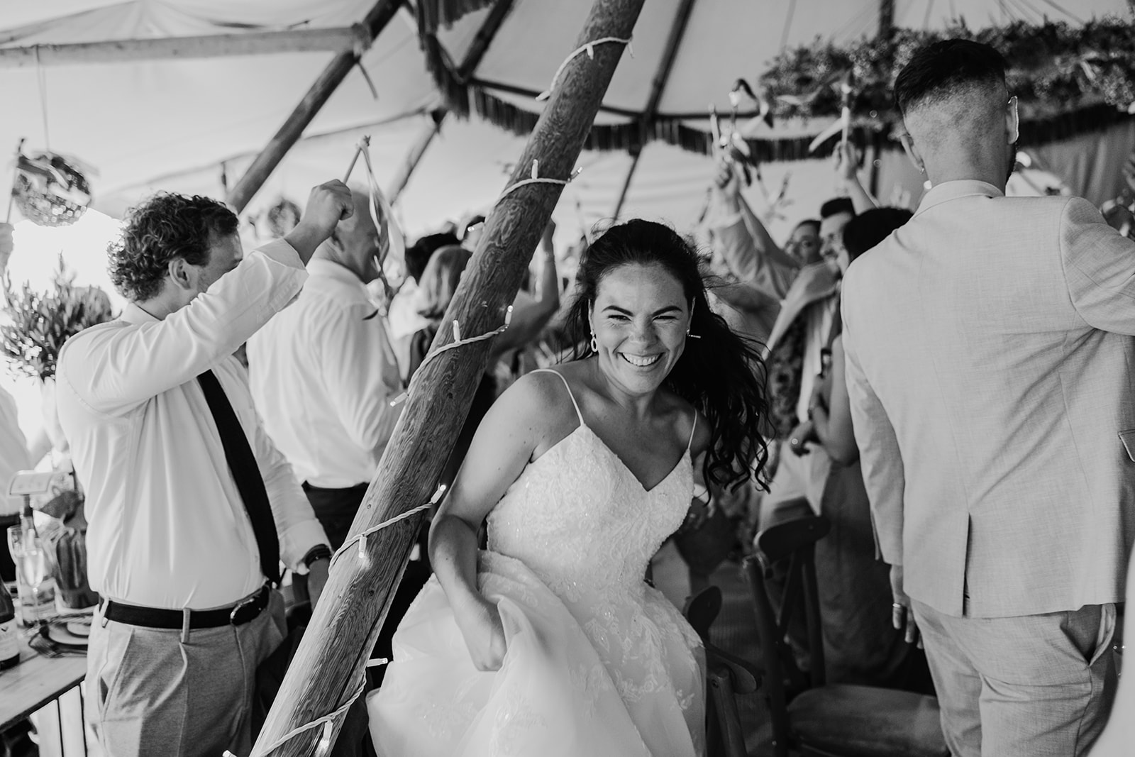 bride enjoys dance floor at tipi wedding in yorkshire