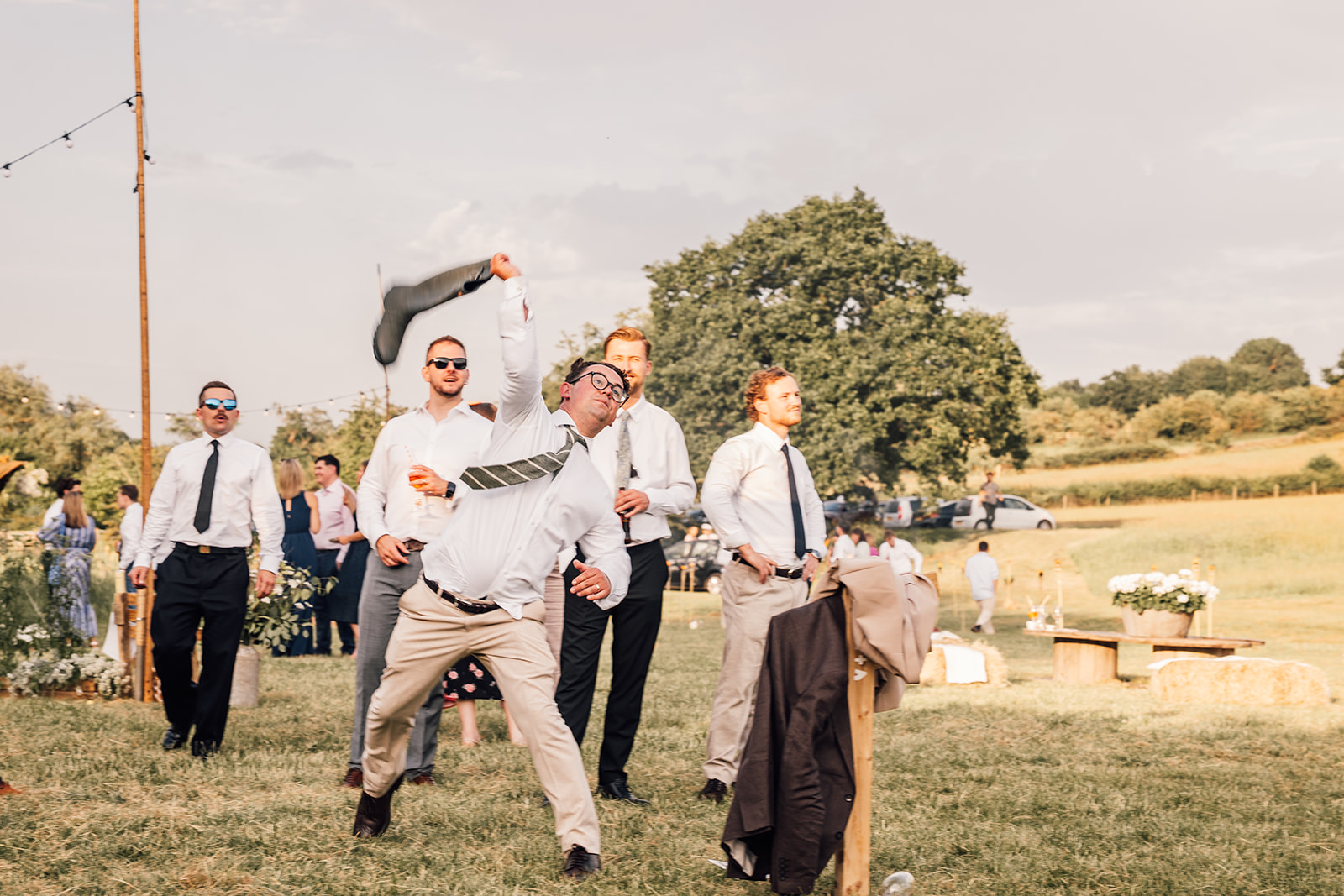 guests enjoy games outside tipi at yorkshire wedding venue