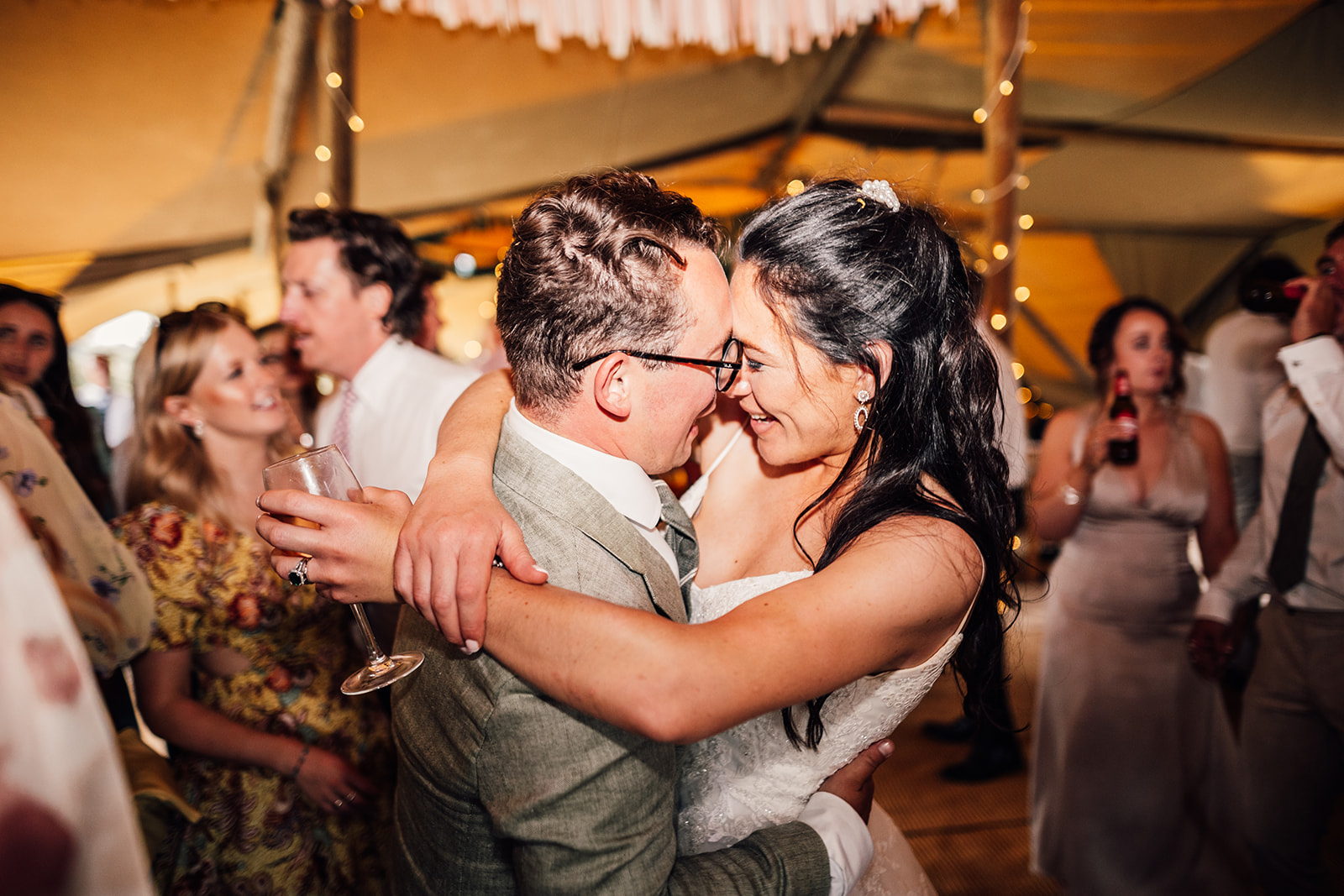 bride and groom share first dance at tipi wedding