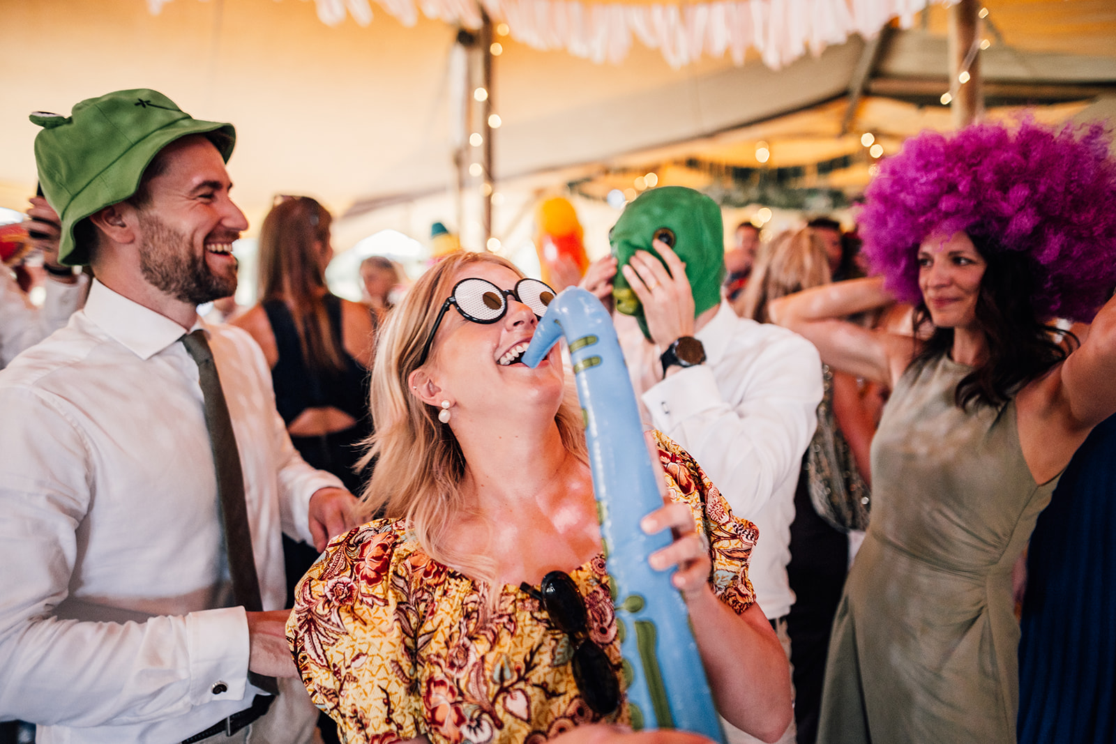 guests enjoying dance floor at summer tipi wedding